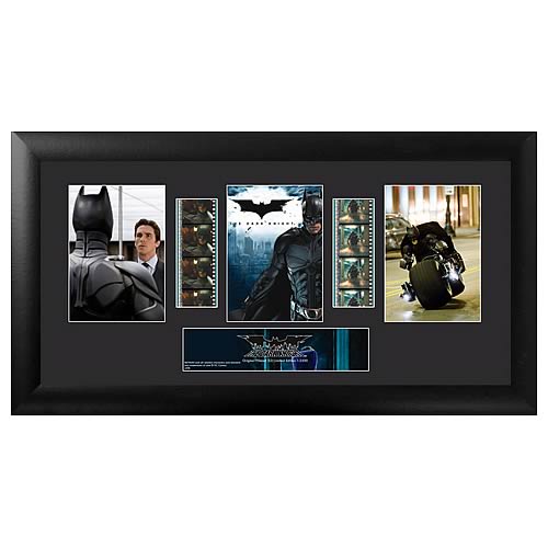 Own a piece of the movie! Beautifully mounted and framed! A must-have collectible! This amazing film cell features a print and an actual strip of film from the film, The Dark Knight . Measures 11-inches tall x 20-inches wide. Perfect for displaying in your home or at the office, all the elements are framed in black wood and includes a certificate of authenticity. Gotham City is under siege once again and it's time for Bruce Wayne (Christian Bale) to put on his bat-costume and do battle with two evil enemies: The Joker (Heath Ledger) and district-attorney-turned-villain Two-Face (Aaron Eckhart). NOTE: The actual strips of film vary from piece to piece as they are hand picked from reels of film.