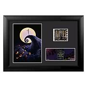 Film Cells > Nightmare Before Christmas - Own a piece of the movie! Beautifully mounted and framed! A must-have collectible! It is the same routine every year in Halloweentown, on Halloween the monsters come out and perform a real scare. This particular Halloween, the pumpkin king Jack Skellington, bored of the idea, saunters off into the woods with his dog Zero after Halloween night. Upon the break of dawn, he discovers a clearing of trees with different doors representing various holidays. The Christmas Tree door attracts his attention and upon entrance into the world of Christmas, Jack is fascinated with this new idea of Christmas that he must absolutely share with the citizens of Halloweentown! This highly-detailed framed mini film cell measures 5-inches tall x 7-inches wide. Order yours today! Please note that the actual cell of film may vary from piece to piece, as they are hand-selected from reels of film.: Sizes 