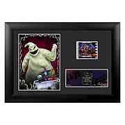 Film Cells > Nightmare Before Christmas - Own a piece of the movie! Beautifully mounted and framed! A must-have collectible! It is the same routine every year in Halloweentown, on Halloween the monsters come out and perform a real scare. This particular Halloween, the pumpkin king Jack Skellington, bored of the idea, saunters off into the woods with his dog Zero after Halloween night. Upon the break of dawn, he discovers a clearing of trees with different doors representing various holidays. The Christmas Tree door attracts his attention and upon entrance into the world of Christmas, Jack is fascinated with this new idea of Christmas that he must absolutely share with the citizens of Halloweentown! This highly-detailed framed mini film cell measures 5-inches tall x 7-inches wide. Order yours today! Please note that the actual cell of film may vary from piece to piece, as they are hand-selected from reels of film.: Sizes 