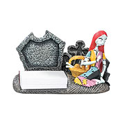 Office > Nightmare Before Christmas - Celebrate Christmas and Halloween...any time of year! A stunning resin notepad holder featuring Sally from  The Nightmare Before Christmas . Fully painted, with notepad included! Nightmare Before Christmas Sally Notepad Holder. Accessorize your office with great Nightmare Before Christmas Style! This detailed notepad holder features Sally in a graveyard next to a tombstone where the included notepad sits in place. Measures 4-inches tall x 6 1/2-inches wide x 4 1/2-inches long. Makes a great paperweight or desk top statue. Order yours today!: Sizes 