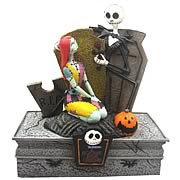Paperweights > Nightmare Before Christmas - Celebrate Christmas and Halloween...any time of year! Stunning resin paperweight featuring Jack Skellington and Sally from  The Nightmare Before Christmas . Fully painted and highly detailed! Nightmare Before Christmas Jack Skellington and Sally with Rose Deluxe Paperweight. Accessorize your office with great Nightmare Before Christmas Style! This deluxe figural paperweight features Jack and Sally sitting on a tombstone in the graveyard - and Jack gives Sally a rose! Measures 5 1/2-inches tall x 4-inches wide x 2 1/2-inches long. Makes a great paperweight or desk top statue! Order yours today!: Sizes 