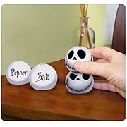 Kitchenware > Nightmare Before Christmas - Add some Halloweentown flair to your spice rack! Need some seasoning? Reach for the smiling face of Jack Skellington! Delightful set of stackable salt and pepper shakers. Add some Halloweentown flair to your spice rack with this Nightmare Before Christmas Stackable Salt and Pepper Shaker Set. Featuring the smiling face of Jack Skellington from Tim Burtons classic  The Nightmare Before Christmas , these salt and pepper shakers are stackable, too! Order yours today!: Sizes 